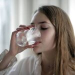 Girl drinking water from a glass